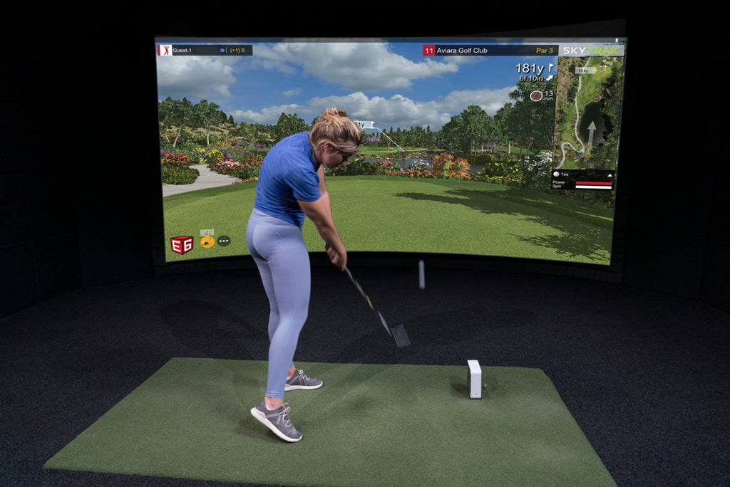 Woman practicing her swing with the most popular consumer launch monitor ever sold