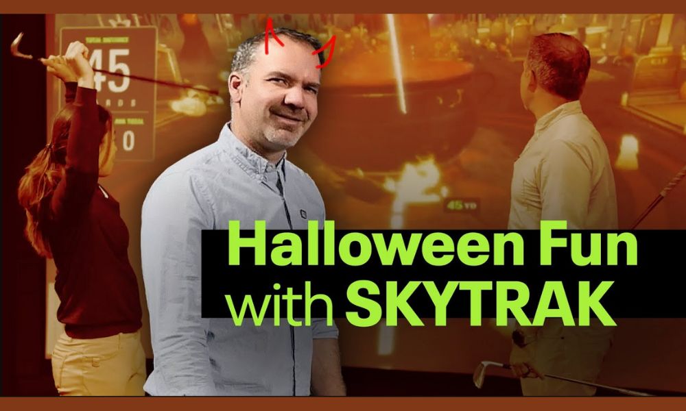 Man with red hair and horns in front of a screen with 'Halloween Fun with SKYTRAK' text.